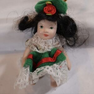 Vintage Miniature Porcelain Doll Ornament wearing Green Christmas Dress Ornament